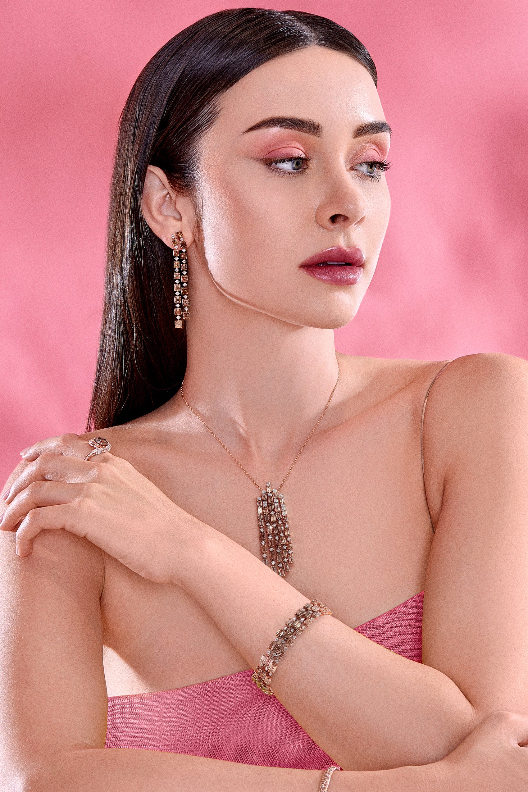 Fashion model wearing Emerald Cut Brown Diamond Necklace, earrings and bracelet from J Fine diamonds