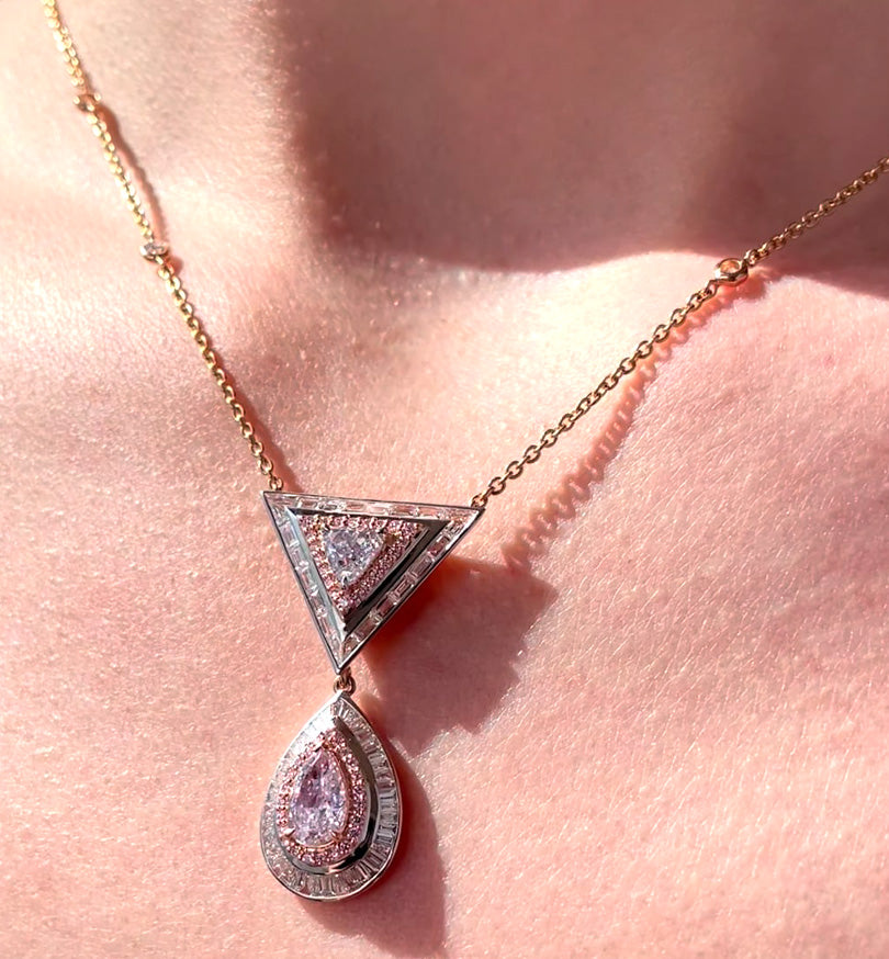 blue diamond and pink diamond necklace triangle and pear shape