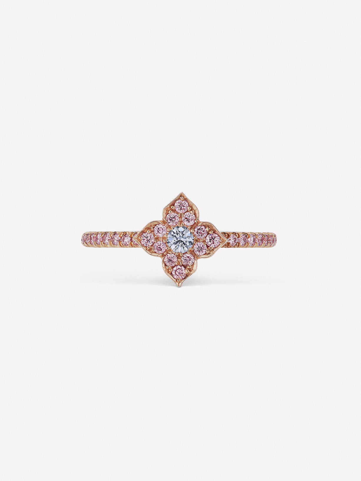 Pink diamond ring with blue diamond at the center of J Fine floral azalea design