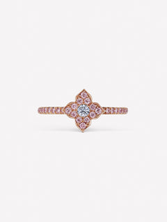 Pink diamond ring with blue diamond at the center of J Fine floral azalea design